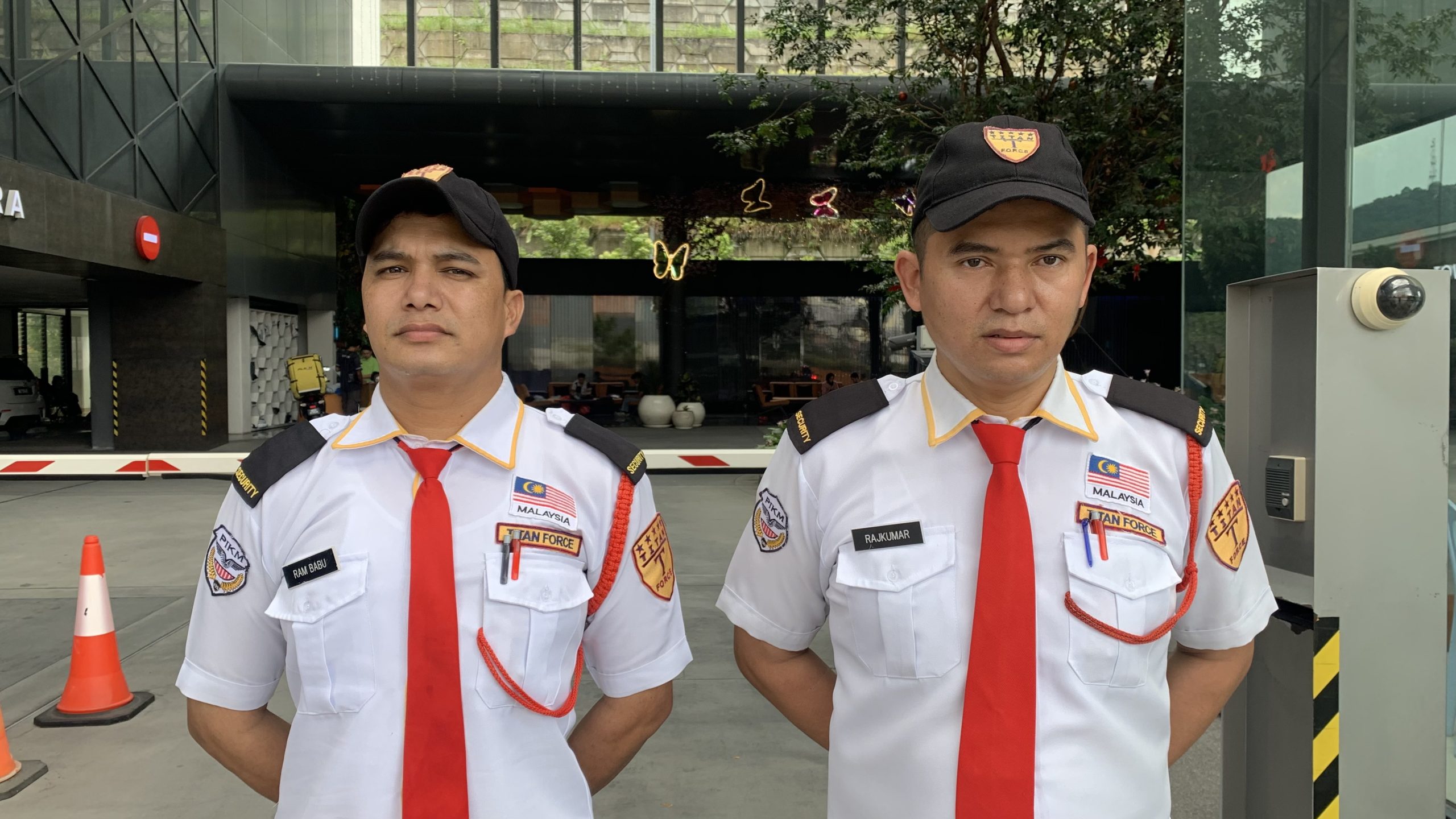 Professional security guard in uniform from Titan Force providing certified security services in Malaysia